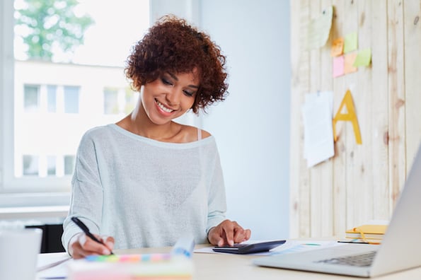 woman calculating variable cost