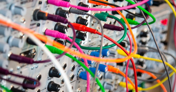 Colorful wires plugged into a dashboard