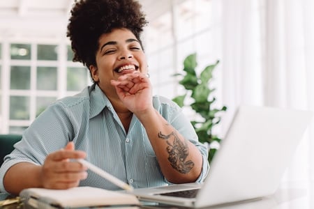 Woman enjoys a moment of realization as she studies data masking and what it means.