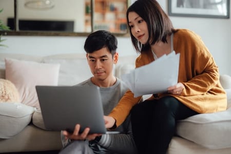 Woman showing a form template to her husband 