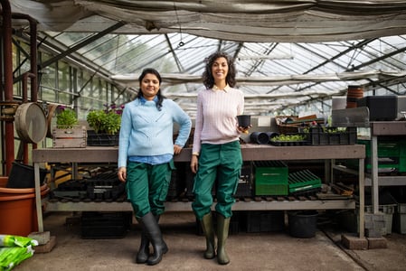 small business owner happy about improving her google ranking for a plant nursery