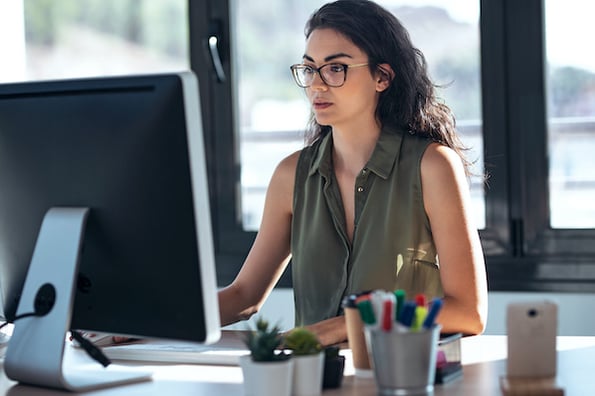 Woman evaluating proxy vs VPN for securing internet traffic