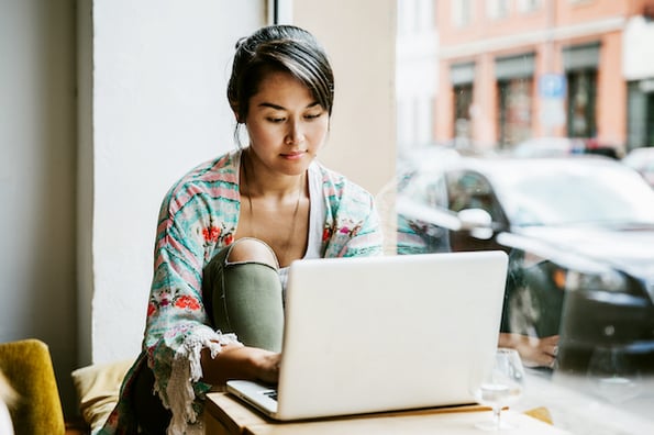 person using a laptop to solve wordpress challenges