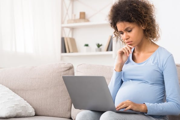 woman using a laptop to find wordpress import plugins