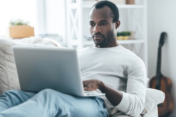 person using a computer to set up a wordpress redirect