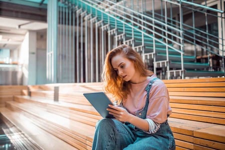 woman studying flashcards powered by css card animations on an ipad