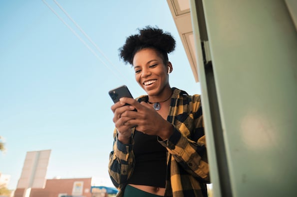 person using a mobile phone to use a website with mobile optimization