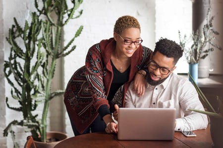 two people looking at different versions of websites