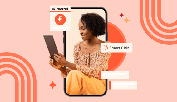 A HubSpot customer using HubSpot's AI-powered Smart CRM on her tablet