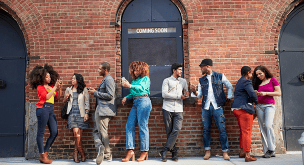 Customer retention at work with several customers lined up outside of a business ready to make a purchase