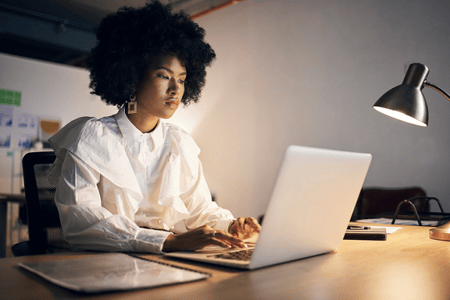 Young woman learning about AI and and the limitations presented when generating code using AI software.