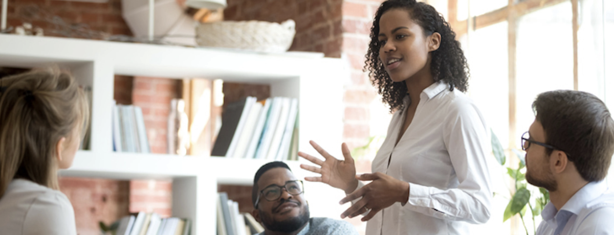 a marketing leader runs a meeting