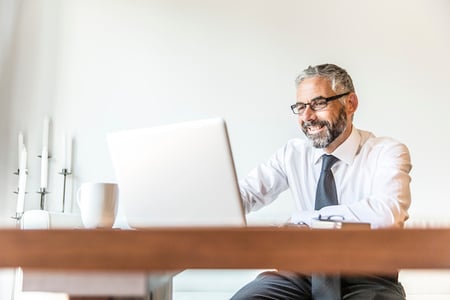 Portrait of smiling businessman working on 4 api authentication methods 