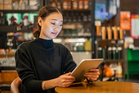 Person on tablet studying API monitoring tools