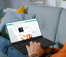 person using a laptop on a couch