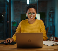 person using a laptop in an office