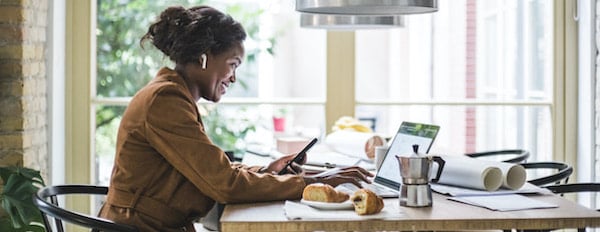 person using a computer in a kitchen