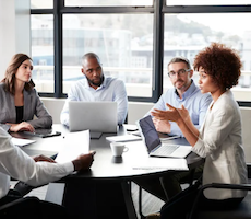 group of people talking in a conference room