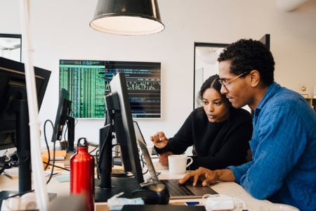 Coders search for the best WYSIWYG editor on a computer at work.