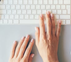 hands typing on a keyboard