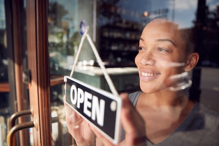 Woman opening an new shop as a brand extension