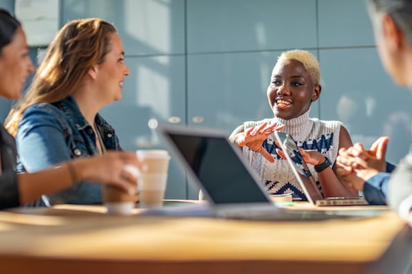 co-workers discuss internal communication strategies