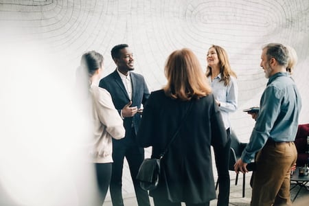 business professionals speaking at a networking event