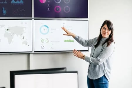 Woman discusses market share during meeting 