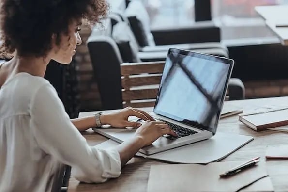 Woman typing while utilizing comma rules