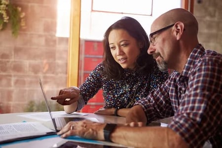 two marketers discussing content pruning