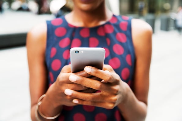 customer giving real-time feedback on her mobile phone