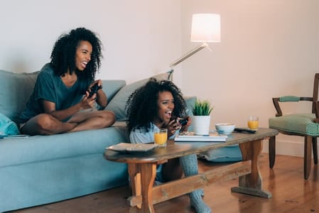 Two women play video games