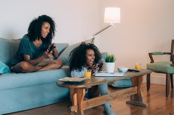 Two women play video games