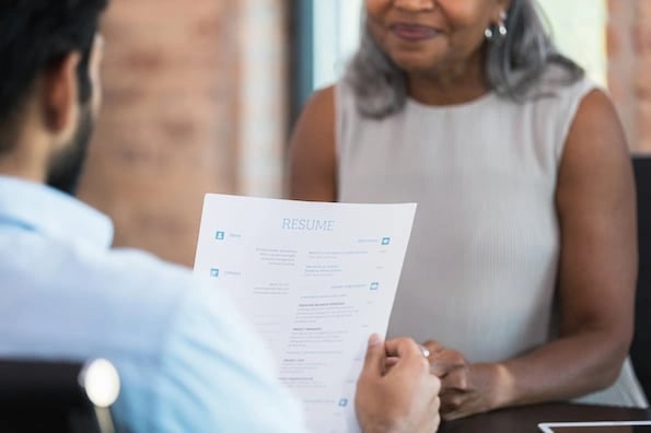 job applicant landing a job interview after writing the best customer service resume