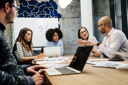 people discussing data democratization in an office conference room