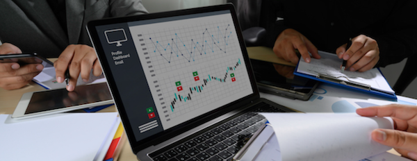 a laptop displaying two charts