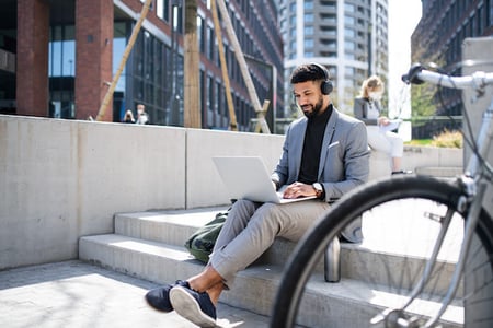 person listening to a devops podcast outside