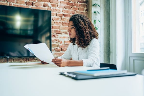 A sales rep reading a document.