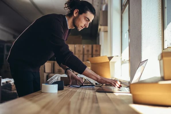 person on laptop working on ecommerce loyalty program