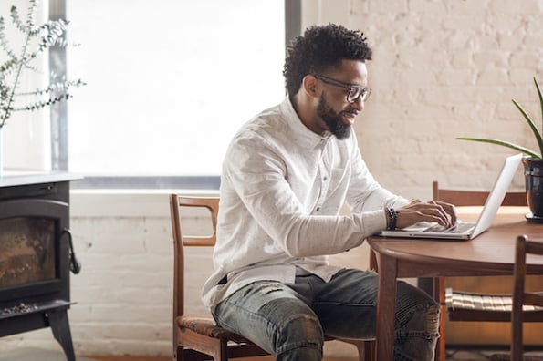 person using a computer to learn ecommerce website development