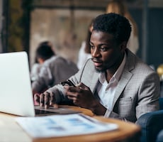 person using a computer in a cafe