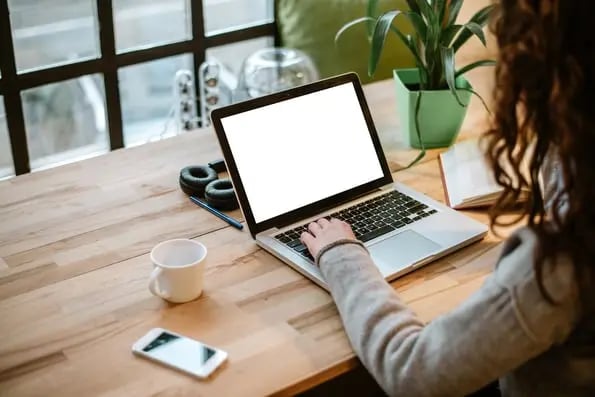 marketer reading on laptop about best web form design practices