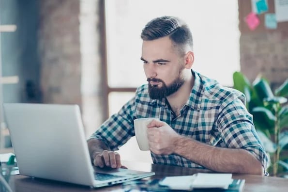 man on laptop working on google forms