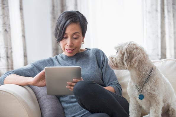 person taking how did you hear about us survey at home on tablet