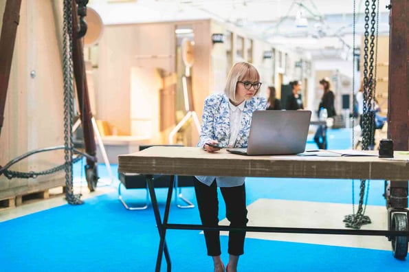 Person learning how to call a function in javascript at a standing desk