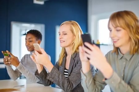 Employees learning how to create a group email in Gmail