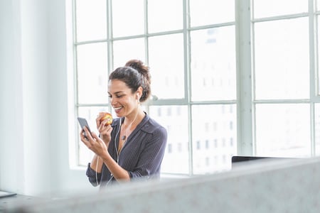 Woman smiling at work learning how to use the rel attribute in HTML