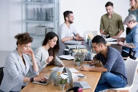 marketers working in an office on integrated media planning