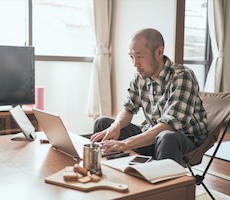 person using a laptop on a coffee table