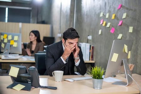 quiet quitter sitting at desk 